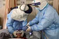 Medics attending to a Chinese patient in Wuhan. First Coronavirus death in Kenya: 66-year-old man dies of Covid-19 at Aga Khan Hospital