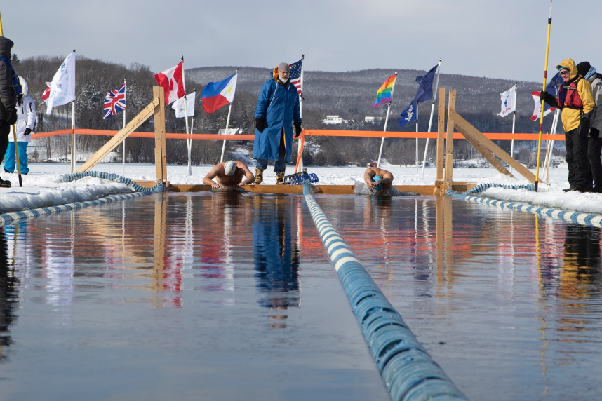 Competitors crowell and born swim aggressively for during their 25 meter fly race