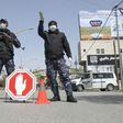 Palestinian security forces man a checkpoint at a key entrance to the city of Hebron earlier this year