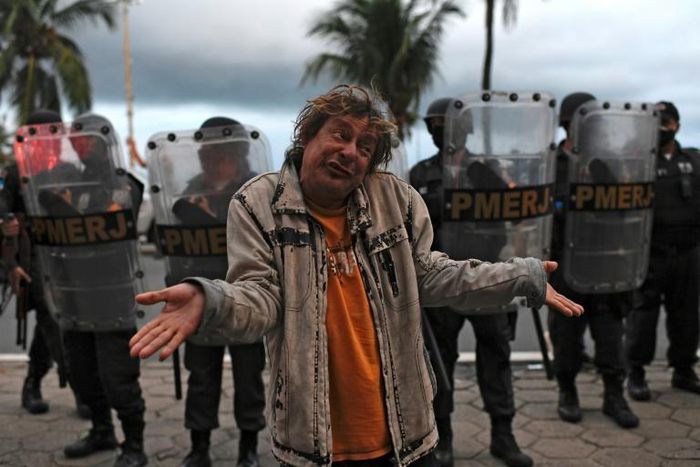 Protestors against Brazilian President Jair Bolsonaro and the way he has dealt with the coronavirus pandemic gathered at Copacabana beach in Rio de Janeiro