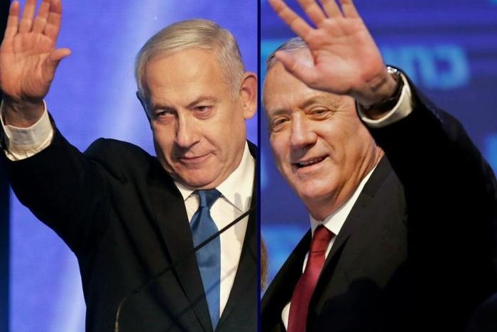 Israeli Prime Minister Benjamin Netanyahu (L) and his former rival Benny Gantz agree on a new coalition government putting an end to Israel's longest political crisis