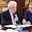 Argentina's President Alberto Fernandez (R) and Health Minister Gines Garcia at a cabinet meeting on tackling the coronavirus outbreak