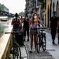 People stroll along the Navigli canals in Milan where police were on patrol to ensure they respected social distancing norms amid fears of a coronavirus resurgence as Italy, one of the worst affected country, eases its strict lockdown rules