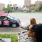A supporter of President Donald Trump in Kansas City, Missouri waves an American flag during a protest against restrictions imposed on businesses to fight the COVID-19 pandemic