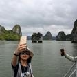 Local tourists take selfies in Ha Long Bay
