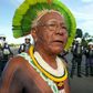 Indigenous chief Paulinho Paiakan, shown here standing in front of riot police in Brasilia, Brazil, on April 27, 2017 has died after contracting the new coronavirus, activists say