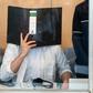 Defendant Sief Allah H. holds a folder in front of his face at the start of his trial on June 7, 2019 at a court in Duesseldorf, western Germany