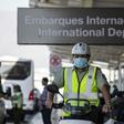A policeman wears a face mask to prevent the spread of the new Coronavirus at the Santiago international airport