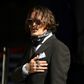 Johnny Depp said the headline in The Sun tabloid altered his Hollywood image and endangered his career