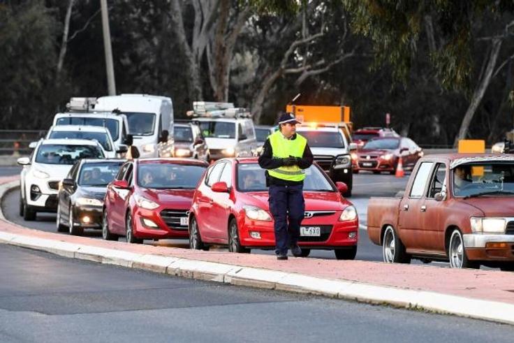 Long queues of cars were backed up at Victoria's border Wednesday after neighbouring state New South Wales closed the boundary