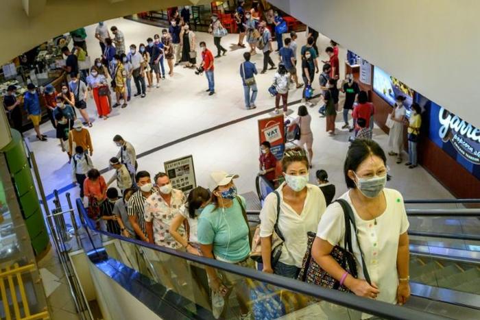Shoppers flocked to Thailand's top-end malls, eager for retail therapy as shopping centres reopened