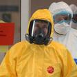 Russian President Vladimir Putin wears protective gear during a visit to a hospital with patients infected with the COVID-19 novel coronavirus
