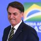 Brazilian President Jair Bolsonaro gestures during the inauguration ceremony of Andre Mendonca as new Justice Minister at Planalto Palace in Brasilia, on April 29, 2020