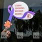 A woman cleans the glass door of a Mexico City restaurant with a sign reading 'We stand with those who make us giants' during Monday's 'A Day Without Us' protest