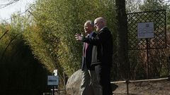 Chinese Ambassador Cui Tiankai (left) speaks to the director of the National Zoo, Dennis Kelly, as they wait for the departure of giant panda Bao Bao in February 2017
