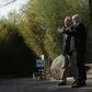Chinese Ambassador Cui Tiankai (left) speaks to the director of the National Zoo, Dennis Kelly, as they wait for the departure of giant panda Bao Bao in February 2017