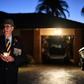 Veteran Peter McFarlane holds a candle during an Anzac Day dawn vigil outside his house in suburbs of Sydney