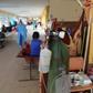 Patients with COVID-19 are treated in the corridor of a hospital in the Amazon city of Iquitos, on May 14, 2020