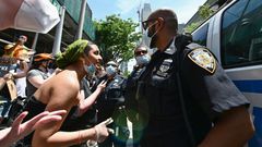 Protesters and police in Brooklyn on 17 June 2020