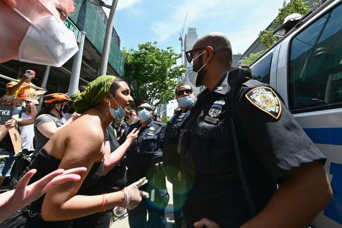 Protesters and police in Brooklyn on 17 June 2020