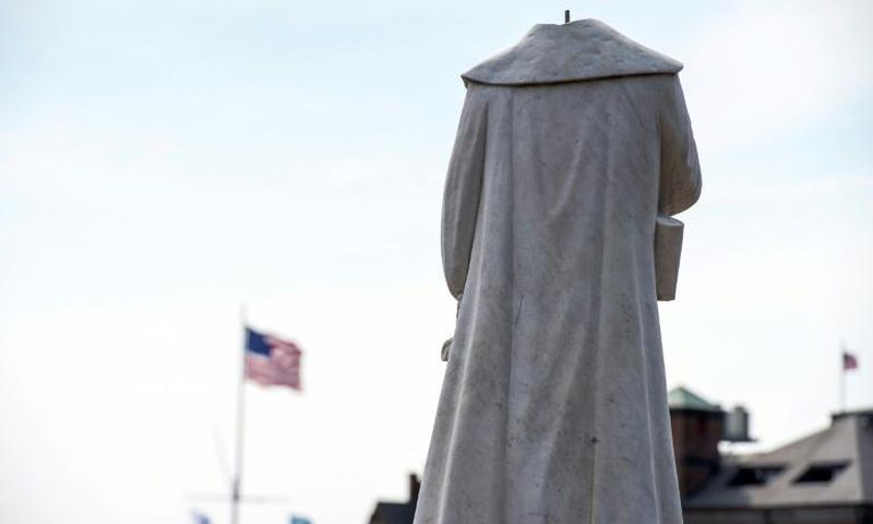 A decapitated statue of Christopher Columbus in Boston, Massachusetts