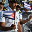 Members of the Navy display a picture of Cuban former president Fidel Castro during the May Day parade at Revolution Square in Havana, on May 1, 2016