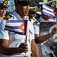 Members of the Navy display a picture of Cuban former president Fidel Castro during the May Day parade at Revolution Square in Havana, on May 1, 2016