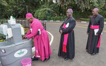Clergy wash their hands before the service at the National Day of Prayer Coronavirus pandemic