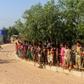 Security personnel use a loudspeaker to raise awareness about the coronavirus in a Rohingya refugee camp in southeast Bangladesh