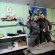 Members of the Russian Imperial Movement who are volunteers of the self-declared Donetsk People's Republic pose with weapon simulators at a training base in Saint Petersburg in 2015