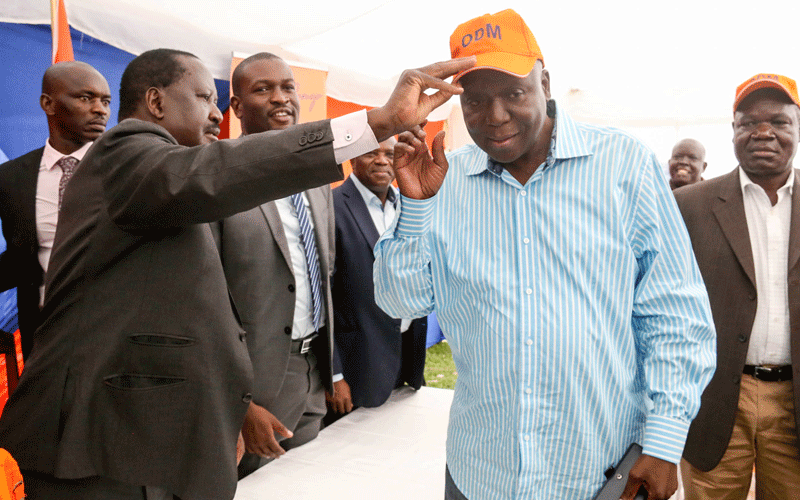 Raila Odinga welcoming ODM party defectors back into the party