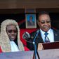 Chief Justice Andrew Nyirenda, left, swears in Peter Mutharika, centre, after Malawi's presidential elections in May last year. Nyirenda later presided over a court decision that tossed out the election result