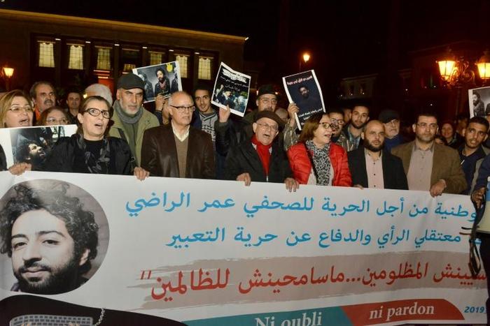 Demonstrators shout slogans during a protest in support of Omar Radi, a Moroccan journalist detained over tweet criticising a judge, on December 28, 2019, in the city of Rabat