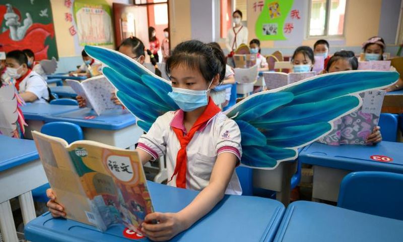 Students are wearing wings to maintain social distancing in Taiyuan in China's northern Shanxi province