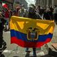 A protester holds an Ecuadorean flag during a demonstration in Quito against wage and budget cuts imposed by the government to tackle the coronavirus pandemic