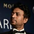 Irrfan Khan poses with a statuette for Best Actor at the 2014 Asian Film Awards