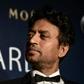 Irrfan Khan poses with a statuette for Best Actor at the 2014 Asian Film Awards