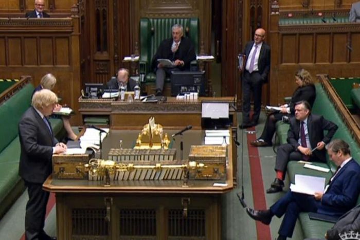 A video grab from footage broadcast by the UK Parliament's Parliamentary Recording Unit (PRU) shows Britain's Prime Minister Boris Johnson giving a statement in the House of Commons in London on the easing of coronavirus restrictions.