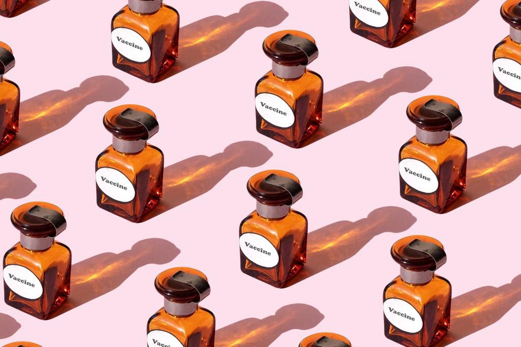 Vaccine vial on the pink background