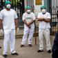 Health workers protest about the lack of protective medical equipment outside the Hipolito Unanue hospital in Lima