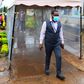 KNH CEO Dr Evanson Kamui goes through a sanitization booth donated by Sonko Rescue Team
