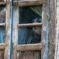 Kashmiri residents watch from their window near the site of a gun battle between suspected militants and Indian government forces on May 19, 2020 in the main city of Srinagar