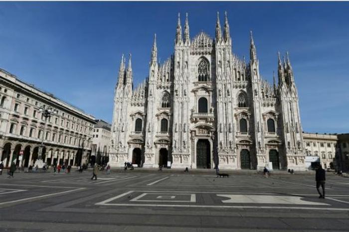 Combo of the Piazza del Duomo and the cathedral in Milan on February 3 (Top) and March 10 before and after restrictions were imposed to halt the spread of the COVID-19 disease