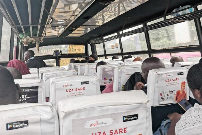 Passenger takes photo inside a Route 111 (Ngong, Karen) matatu that complied with maximum of 60 per cent capacity to facilitate social distancing