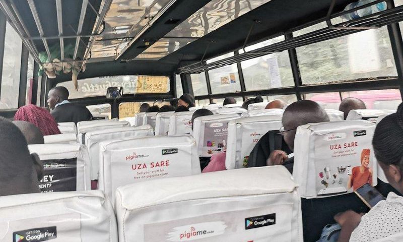 Passenger takes photo inside a Route 111 (Ngong, Karen) matatu that complied with maximum of 60 per cent capacity to facilitate social distancing
