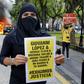 The arrests followed riots in Guadalajara after protesters had gathered to demand justice over Giovanni Lopez's death; a
demonstrator holds a banner during a protest in Guadlalajara, Jalisco