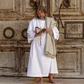 A worshipper prays in front of the closed door of the Holy Sepulchre Church in Jerusalem's Old City amid movement restrictions due to the coronavirus pandemic