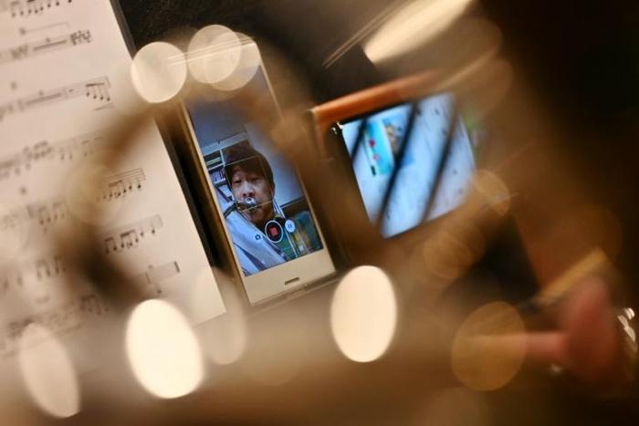 Tuba player Kazuhiko Sato said he was incredulous when the idea of the teleworking orchestra was first floated