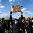 Some 20,000 people protest the 2016 death of a young black man named Adama Traore in French police custody, using slogans echoing those in the demonstrations raging in the US.