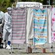 Healthcare workers in protective clothing transport the body of a COVID-19 victim outside Joao Lucio Hospital in Manaus, Brazil, on April 21, 2020